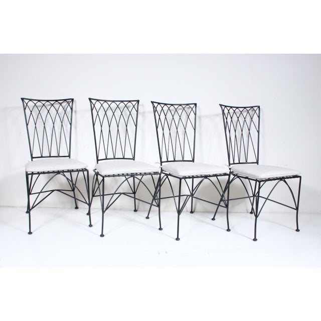 Set of Four Gothic Modern Black Iron & Off White detachable Leather Seat Chairs, circa 1980's. Featuring sturdy black...