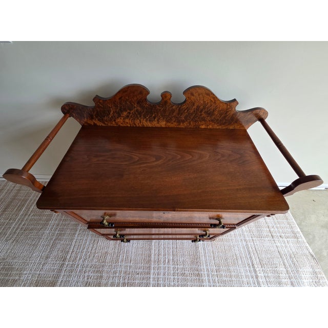 This is a beautiful Empire style chest of drawers. It has a lovely carved gallery top and towel bars, one on each top...