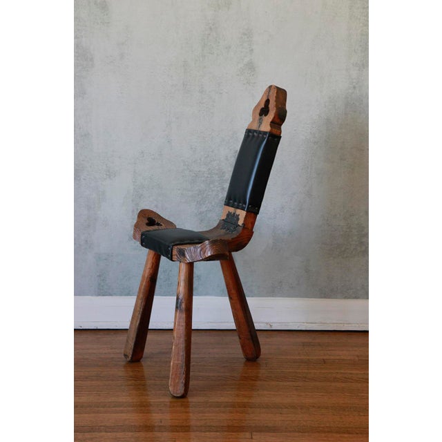 This charming hand-carved fireside chair showcases exquisite Spanish artisan craftsmanship. Its low, wide T-shaped design...