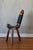 This charming hand-carved fireside chair showcases exquisite Spanish artisan craftsmanship. Its low, wide T-shaped design...