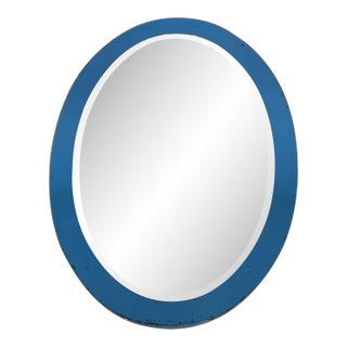 Oval shaped mirror with a bluish outline by Crystal Art Torino. Circa 1960 For Sale