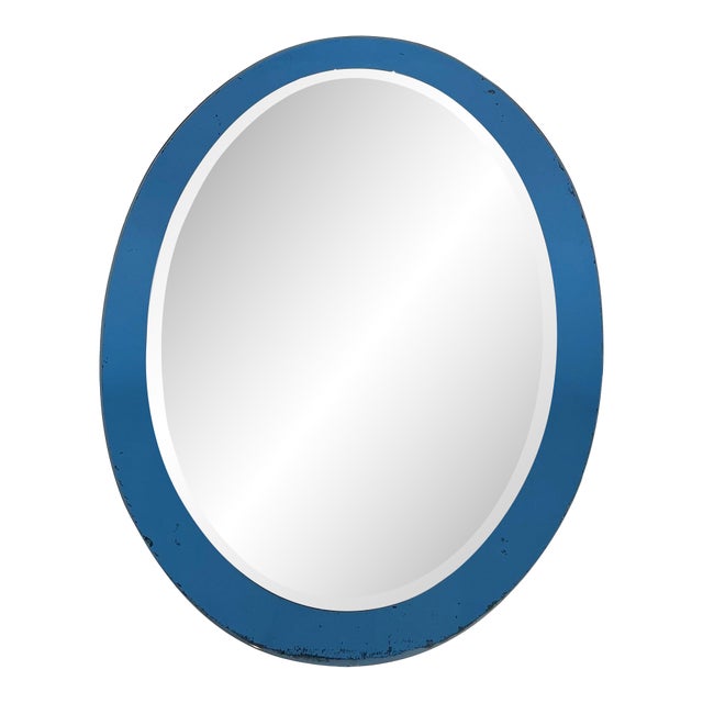 Oval shaped mirror with a bluish outline by Crystal Art Torino. Circa 1960 For Sale