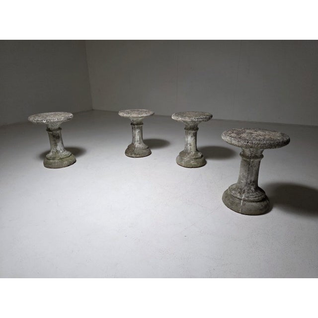 A beautiful set of four french cast concrete stools or side tables from the 1970s. Crafted from solid cast concrete, each...