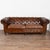 The rich brown vintage leather captures your attention in this wonderful Chesterfield sofa standing just over 7' long. It...