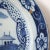 This large, antique Dutch pottery low bowl is painted in the Chinese Export style. DATE 18th century