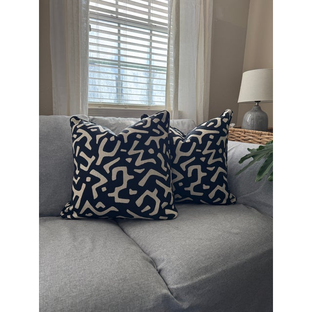 Bring a bold, modern touch to your space with this custom-made pair of 22” pillow covers, featuring a striking black and...