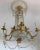 Finely chiseled gilt bronze and cut crystal Empire elegant chandelier with six arms. Six E 14 light bulbs. Up to 250V...