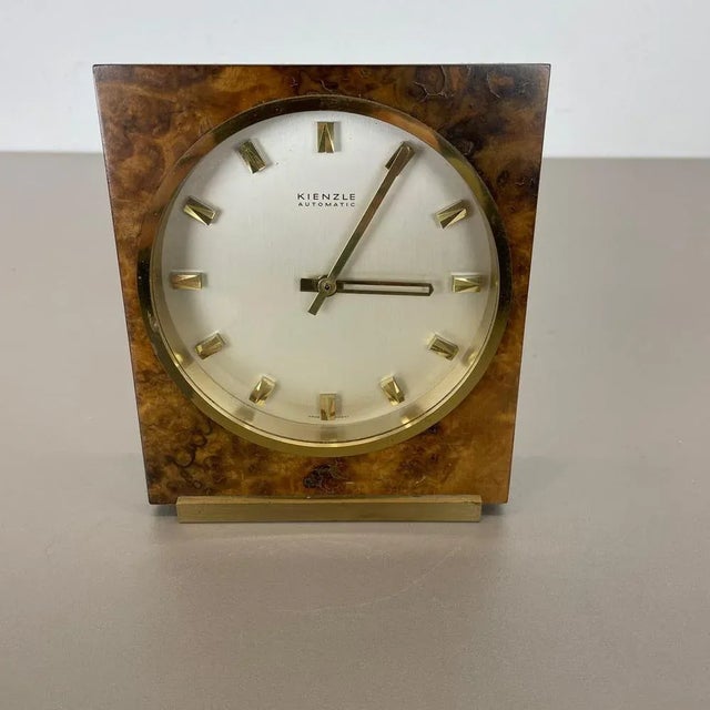 Table clock Origin: Germany Producer: Kienzle, Germany Age: 1960s This original vintage table clock was produced in the...