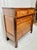 A charming antique American Sheraton/Empire cottage chest crafted in warm cherry wood, featuring a clean, balanced...