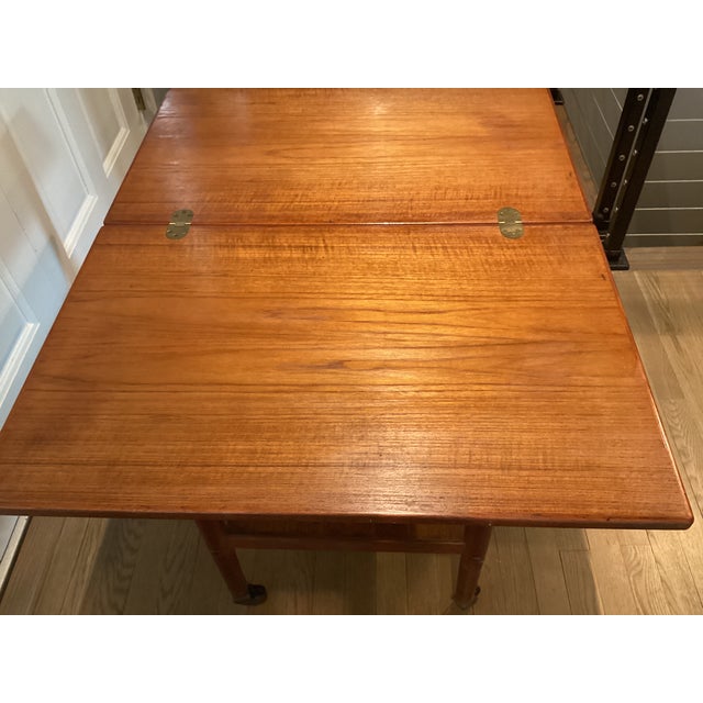 1970s Midcentury Modern Teak Rolling Expandable Table With Shelf For Sale - Image 10 of 12