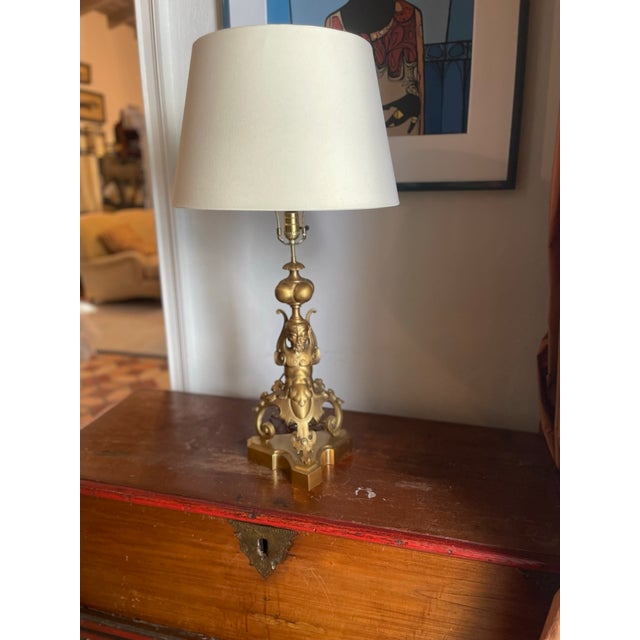 Exceptional pair of 18th century French gilt bronze chenets, circa 1750, later converted into table lamps. Each features...
