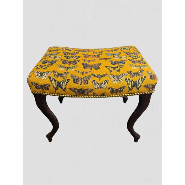 Custom upholstered North Carolina made stool. Wood finished in Vintage Chestnut. Upholstered in "Lady Goldenrod" fabric....