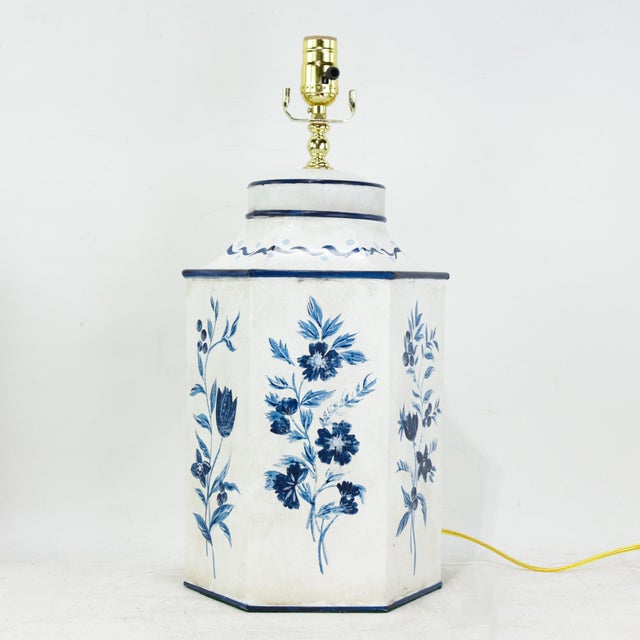 This sophisticated pair of vintage toleware table lamps is expertly crafted from metal in a distinct hexagon tea caddy...