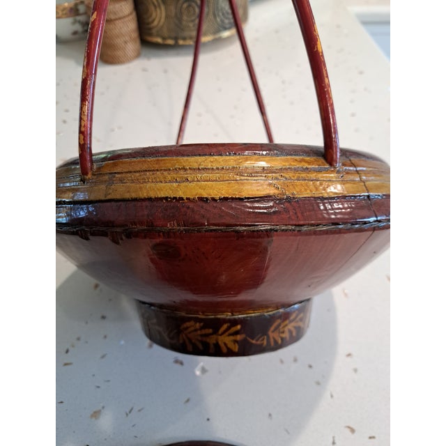 Early to mid 1900's Asian basket with lid. Red lacquer with gold painted embellishment Approx. 13" diameter x 18" high...