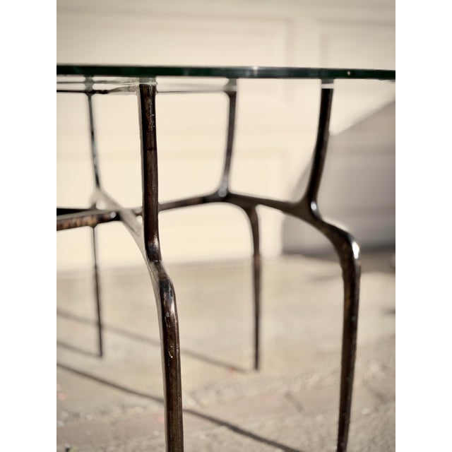 2020s Sculptural Antique Bronzed Iron Legs Round 48” Glass Top Cyrano Dining Table by Made Goods For Sale - Image 5 of 11