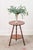 This charming two-tier round table features cane-cut legs with a faux bamboo turned design. Crafted from warm-toned wood,...