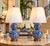 Elegant pair of new Ralph Lauren blue-and-white ceramic table lamps featuring a classic double-gourd silhouette and...