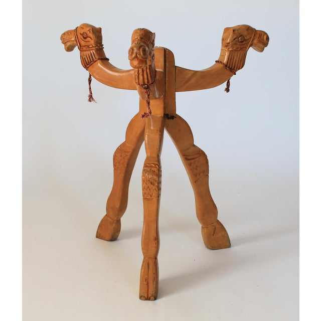 Vintage hand carved wood camel folding table base. No makers mark. Overall age wear to wood. Pictured. Functions as should.
