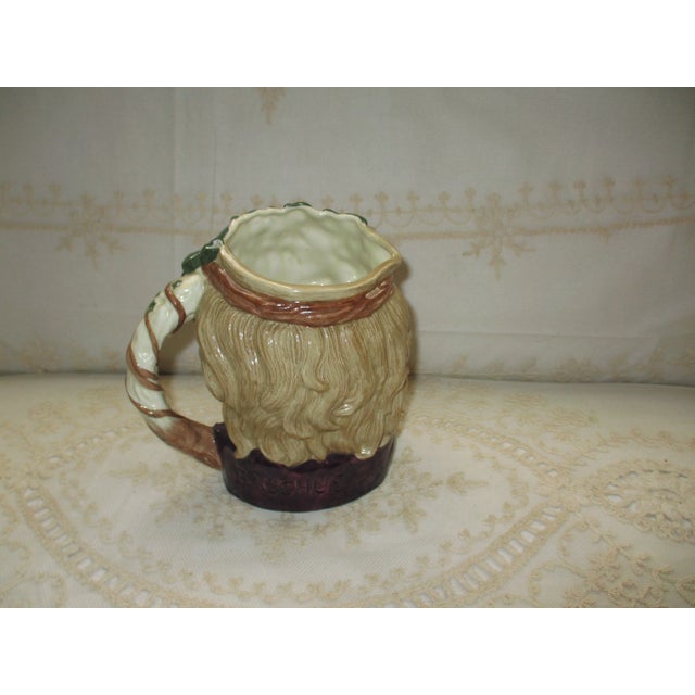 This is a Large Royal Doulton Bacchus D6499 Character Jug 1958 Toby Jug that is 7.25" tall and 7.5" wide and 5" deep and...