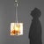 Vintage chandelier in transparent Murano glass with orange inserts and brass details. This piece is attributed to the...
