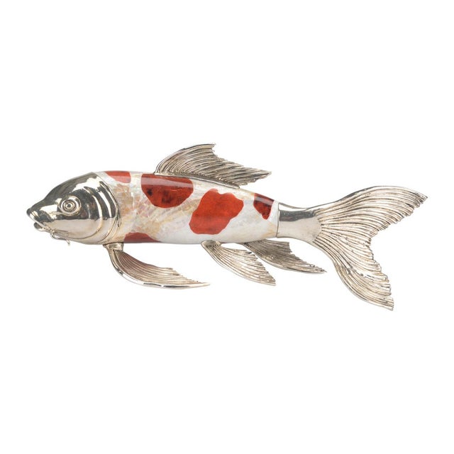 Made with brilliant colors form orange tiger penshell and cracked kabibi and finished with silver plate, the Koi Fish...