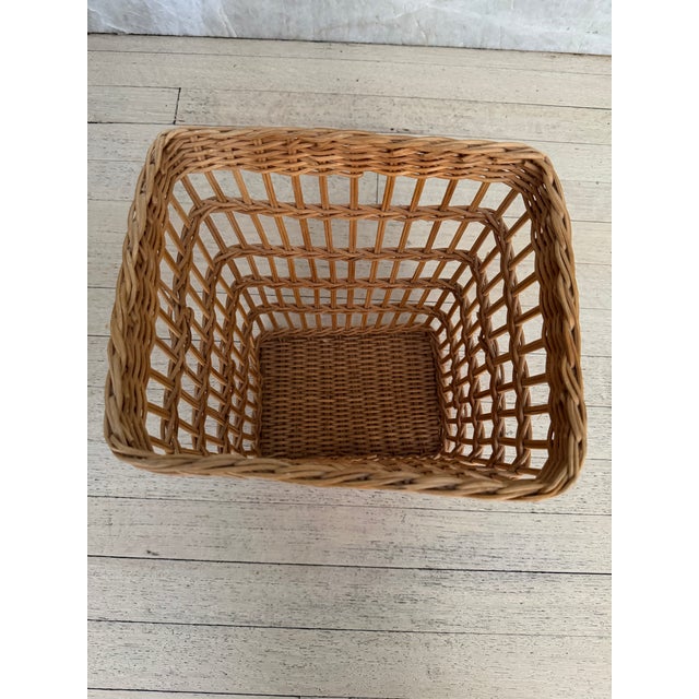 Vintage woven wicker wastebasket with a tapered square silhouette and warm honey toned finish. Perfect for adding texture...