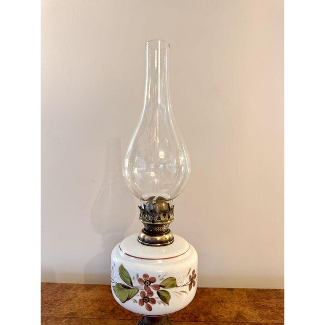 Pretty antique Victorian oil lamp, having a quality antique Victorian oil lamp with a bulbous shaped flume above a single...