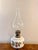 Pretty antique Victorian oil lamp, having a quality antique Victorian oil lamp with a bulbous shaped flume above a single...