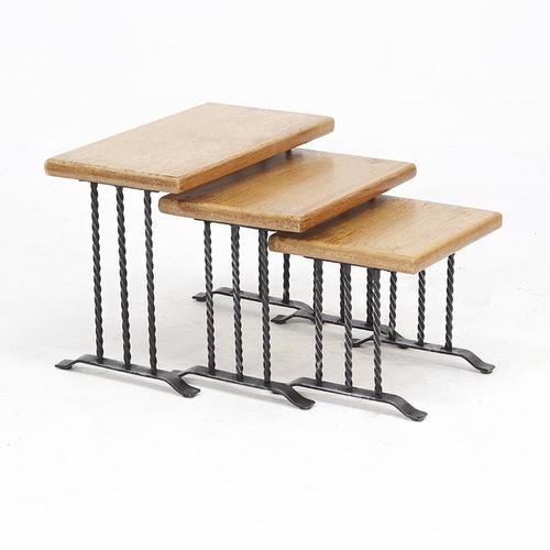 A distinctive set of three side tables in the Brutalist style, characteristic of the 1960s. Featuring a woven iron frame...