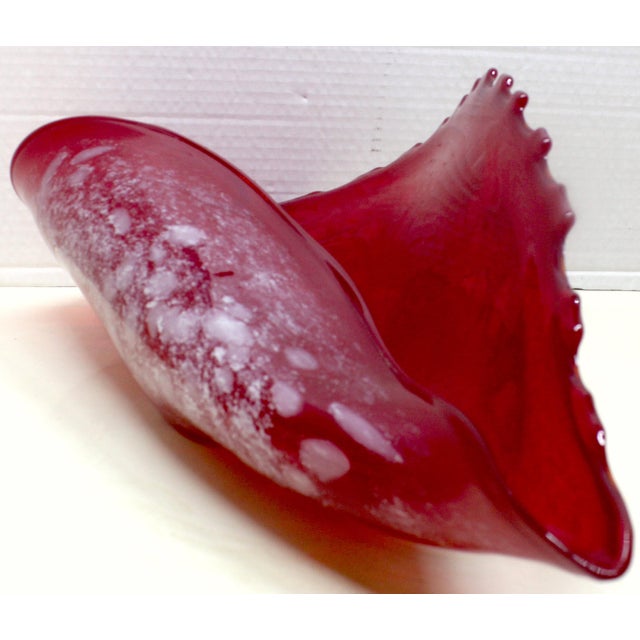 A wave of festive, art-glass-cased vintage conch-shell and centerpiece, Polish-styled Glass Art, characterized by a...