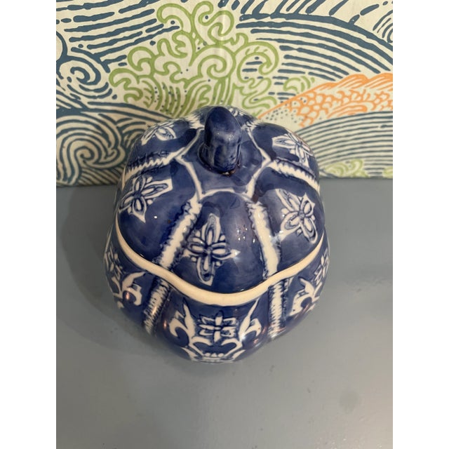 A blue and white collection is not complete without a pumpkin lidded jar. This particular one has a sticker on the bottom...