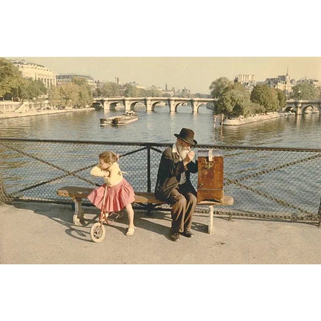 Seine Scene A barrel organ player and child on the Pont des Arts in Paris. From the series Paris in Colour, 1956–1961....
