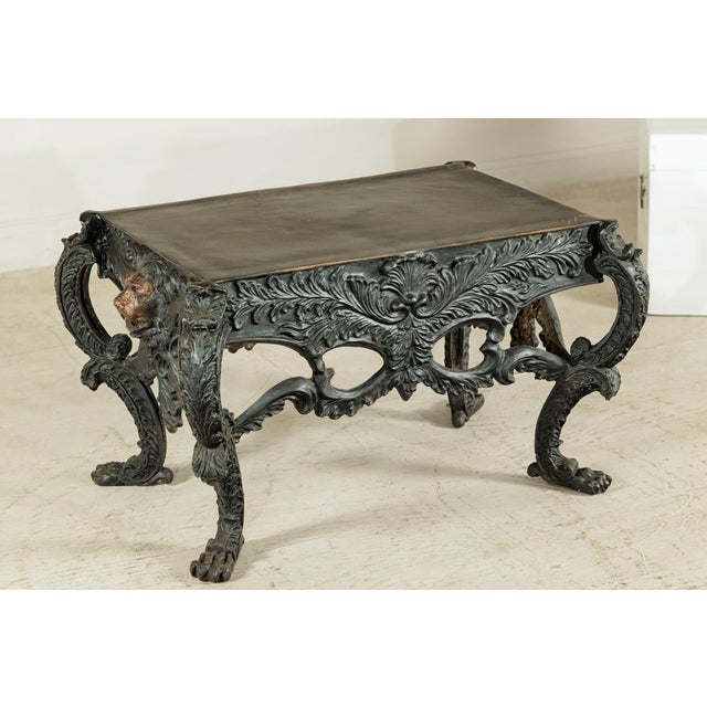 "About the Item This striking bronze table is defined by its sculptural presence and richly detailed design. The...