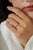 This solitaire ring features a 0.28 carat of marquise-cut diamond set in 14K yellow gold The diamond measuring 3.2 x 5.5...