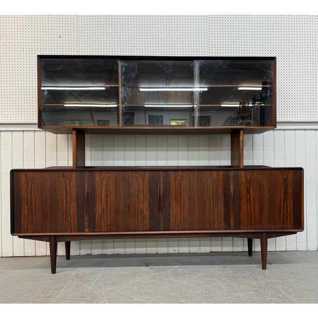 This listing is for a rare Mid-Century Danish Modern Rosewood Sideboard. Featuring a straight line design, hutch top with...