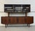 This listing is for a rare Mid-Century Danish Modern Rosewood Sideboard. Featuring a straight line design, hutch top with...