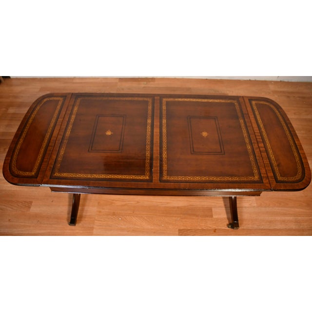 We are pleased to offer this beautiful English Regency coffee table, by Heritage Henredon from the 1930s. This table is...