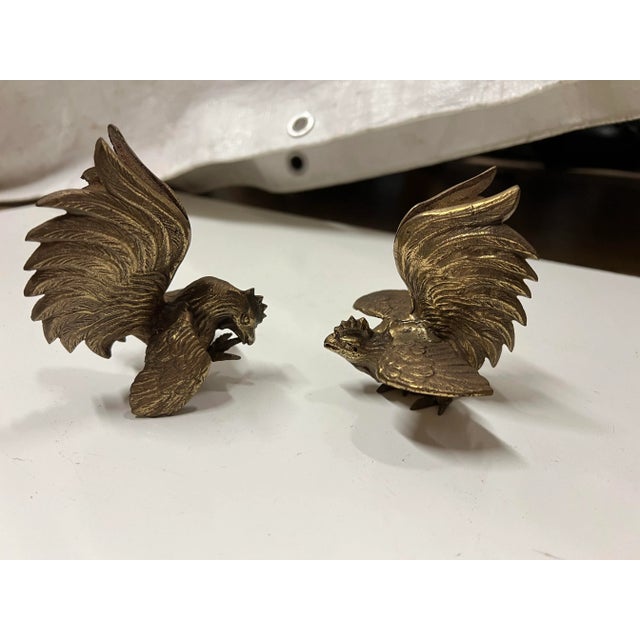 This set of solid brass fighting roosters or cocks was made with great detail. Marked Japan .