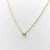 This 14k gold necklace features a beautiful emerald cut diamond, prong set in a rectangular setting, and suspended from a...