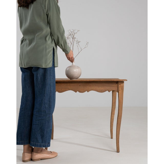 Carved oak side table in Weathered Honey Oak. Finished in weathered honey oak, this carved oak side table is distinguished...
