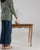 Carved oak side table in Weathered Honey Oak. Finished in weathered honey oak, this carved oak side table is distinguished...