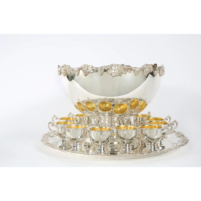 English Georgian style silver plated or copper fifteen piece punch bowl service, complete with twelve decorative cups with...
