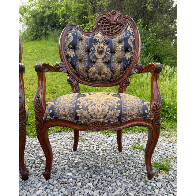 Antique French Rococo Fireside Arm Chairs Hand carved mahogany chairs with blue silk upholstery. Absolutely stunning and...