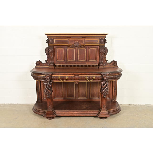 An exceptional antique Victorian or Renaissance Revival sideboard, credenza, or bar cabinet Attributed to R.J. Horner &...