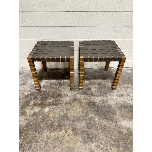 Amazing vintage pair of TA designed end tables with leather strap surface and scalloped legs for days ending in brass...