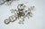 A refined pair of French wall sconces attributed to Maison Bagues, Paris, dating from the 1960s. Each three-arm sconce is...