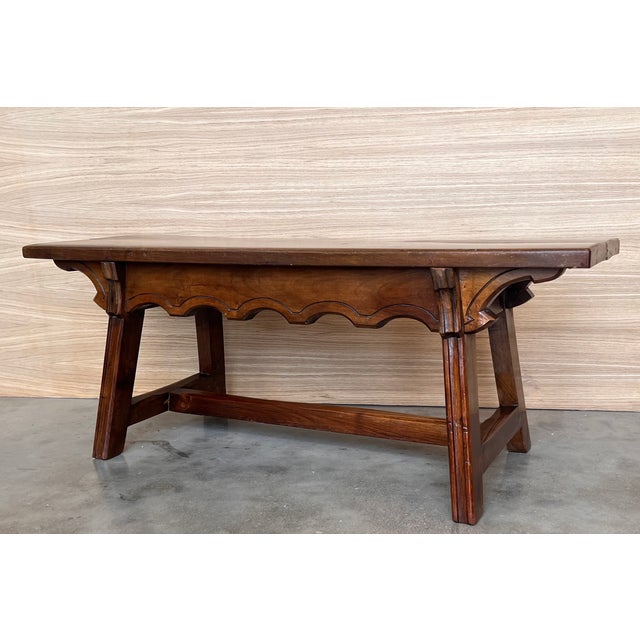 19th Century Spanish Baroque ebonized side or working table with wood stretcher and top in walnut. We have a matching...