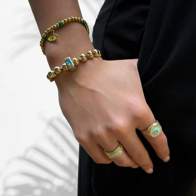 Welcome the freshness of spring on your fingertips with Pastel Colors Diamond & Gold Spring Statement Ring. This exquisite...