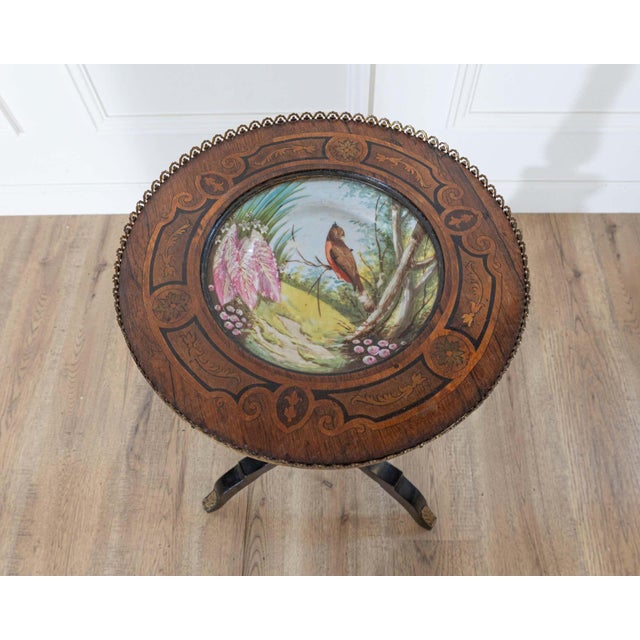 A captivating Napoleon III period pedestal table from 19th-century France, showcasing the elegance and artistry...