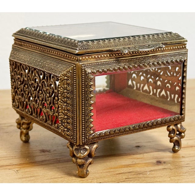 Vintage bass jewelry box perfect for keeping your trinkets and jewelry safe! Lid offers a filigree design handle and...